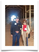 Raqui and Col. Bill Tempero touring the horse stables as they undergo reconstruction